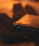 brown bifold wallet